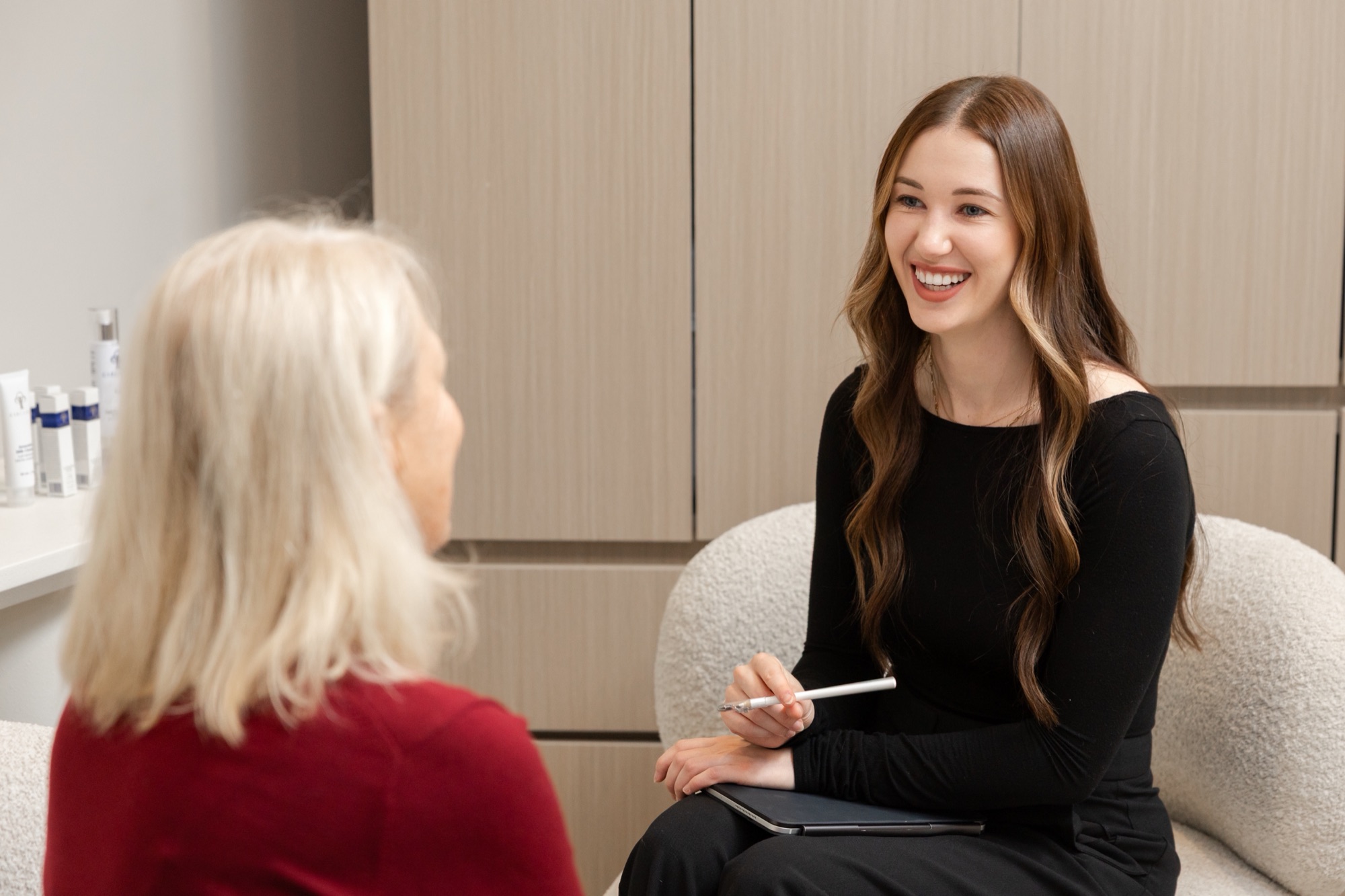 Gabriella consulting with a client about facial aging and treatment options at Jab Lab Melbourne